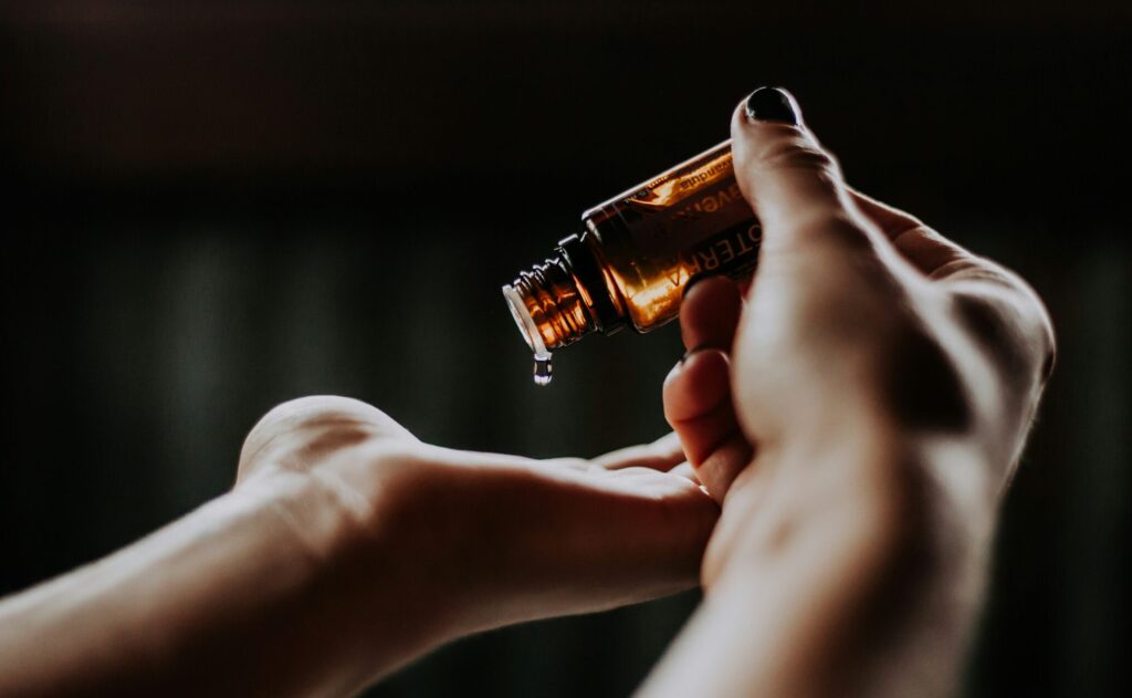 alt="professional massage oil preparation for massage session"